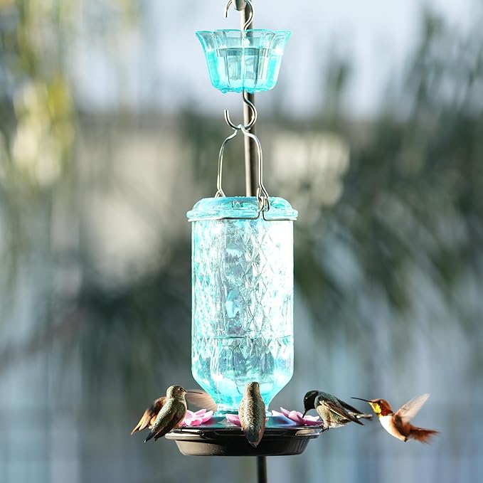 Nature’s Way Dewdrop Column Antique Teal Glass Gravity Hummingbird Feeder with Ant Moat, 23 Ounce Capacity, 6 Flexible Pink Lilac Flower Ports, Continuous Perch Ring, Easy-Clean Pewter Plastic Base